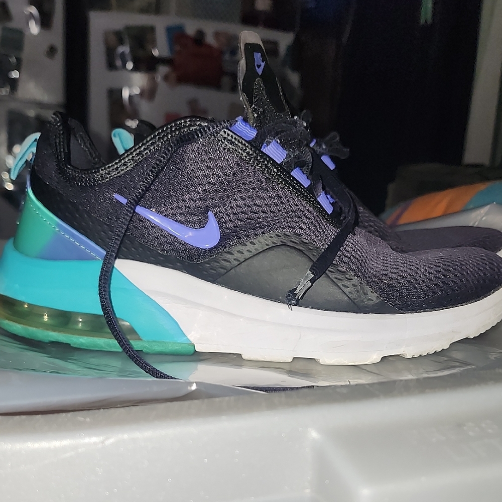  Nike Air Max Motion 2 running shoes in black and purple with teal accents. 